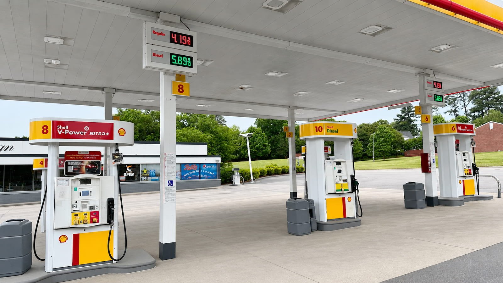 Clean gas station concrete and fuel pump area after commercial pressure washing in Ennis TX