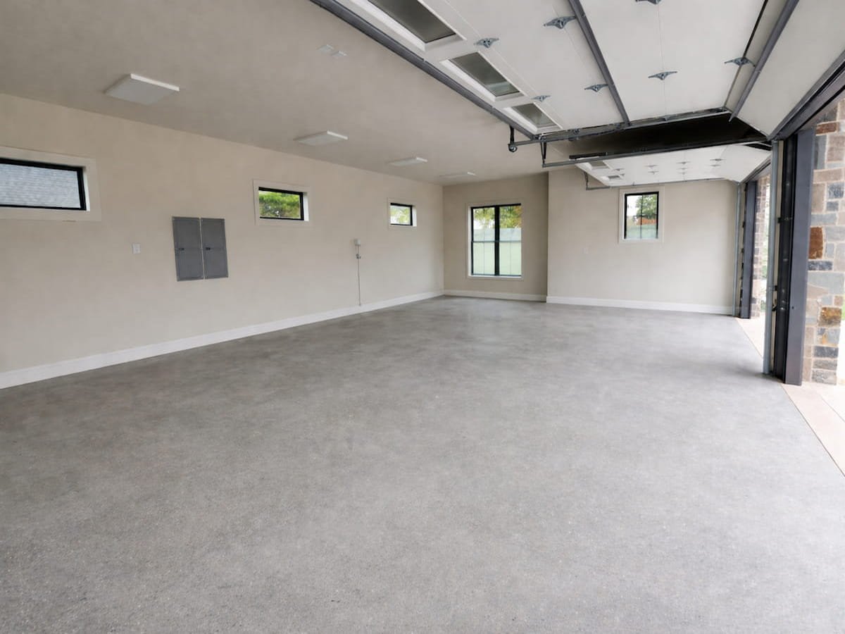 Cleaned post construction concrete garage floor in Corsicana Texas after professional final turnover washing by Bonnie and Clyde's