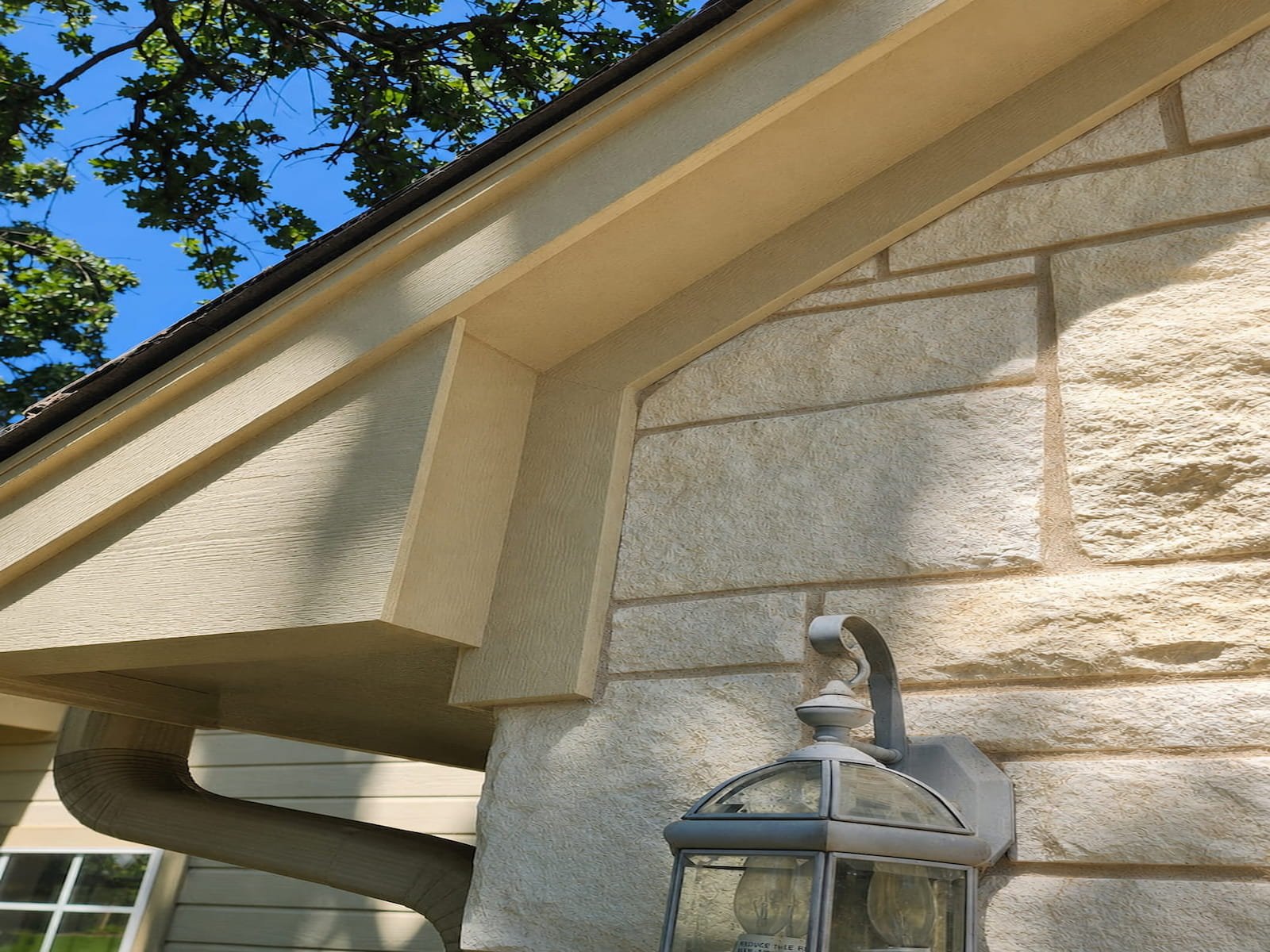 Clean soffit and exterior wall after house washing in Streetman TX