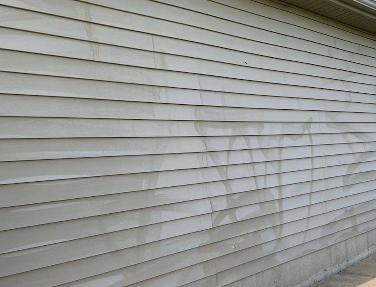 Vinyl siding with visible oxidation before oxidation removal in Athens, TX