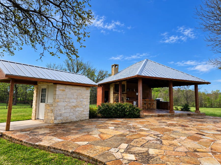 Patio and metal roof after cleaning in Rice, TX