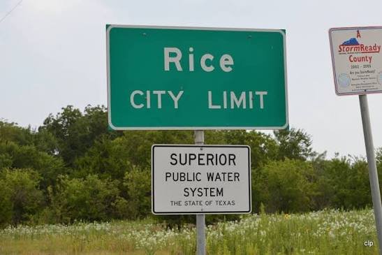 Rice, TX city limit sign along a Texas roadway