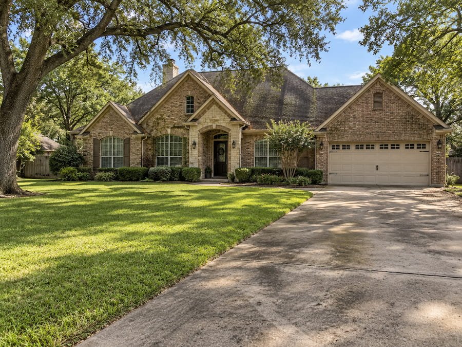 Home before house washing, roof cleaning, and driveway cleaning in Fairfield, TX