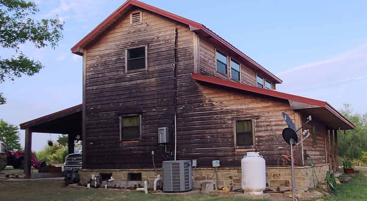 Wood house before cleaning and sealing in Kerens, TX